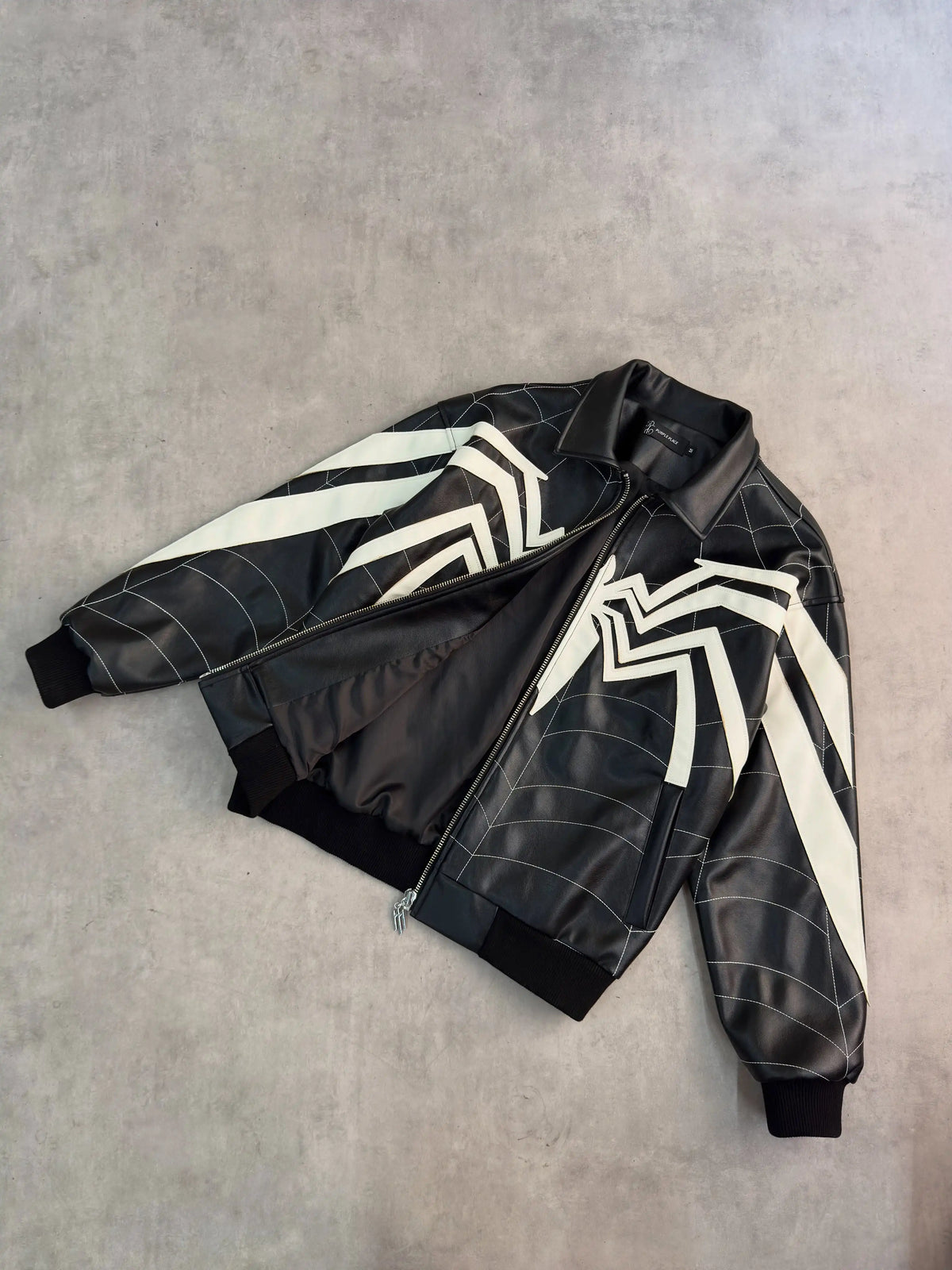 Faux leather patchwork jacket with ribbed cuffs and hem